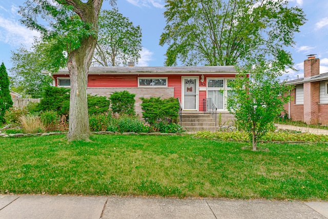 ranch-style home featuring a front yard