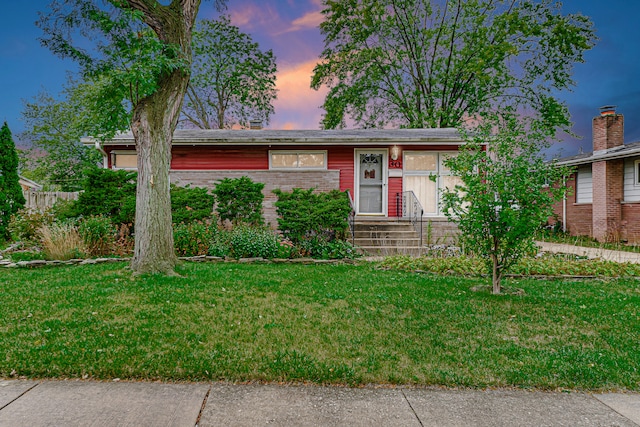 ranch-style house with a lawn