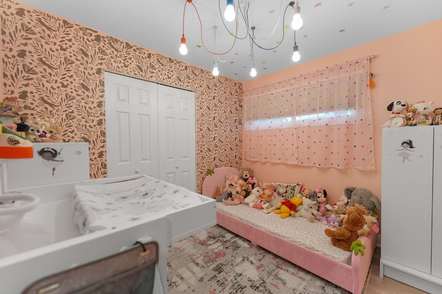 bedroom featuring a closet and white refrigerator