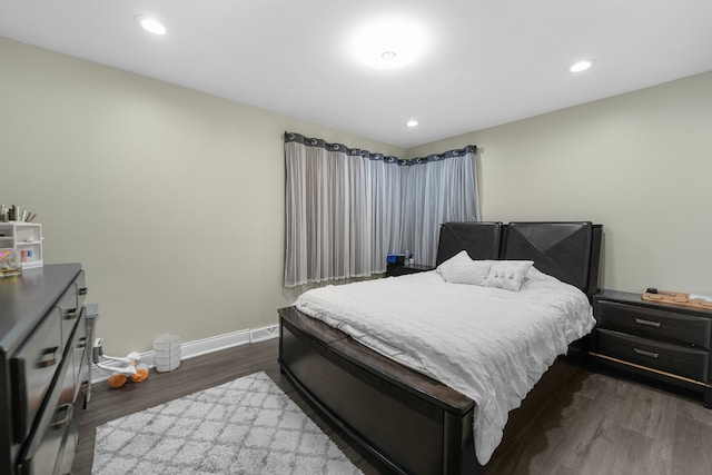 bedroom featuring dark wood-type flooring