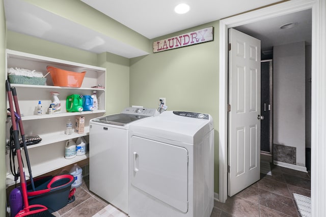 clothes washing area featuring washing machine and clothes dryer