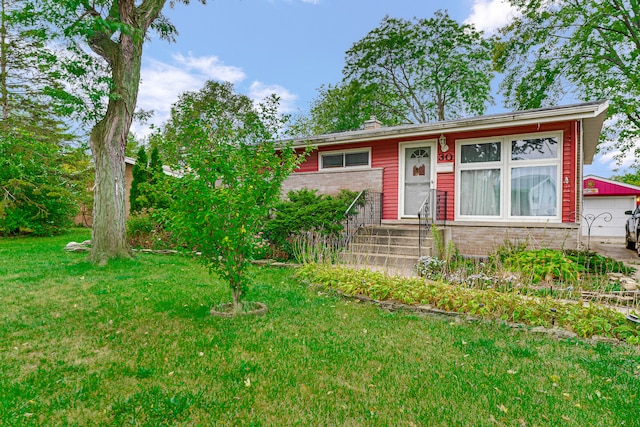 single story home with a garage and a front lawn