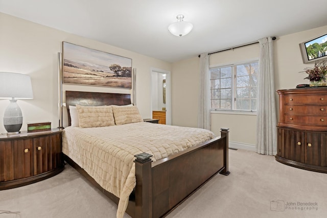 bedroom featuring light colored carpet