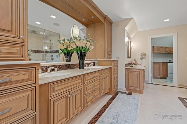 bathroom featuring vanity, tile patterned flooring, and a shower with door