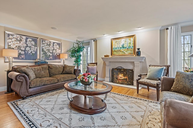 living room with plenty of natural light and ornamental molding