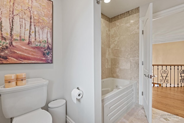 bathroom featuring shower / washtub combination and toilet