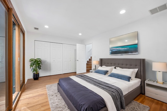 bedroom with light hardwood / wood-style floors