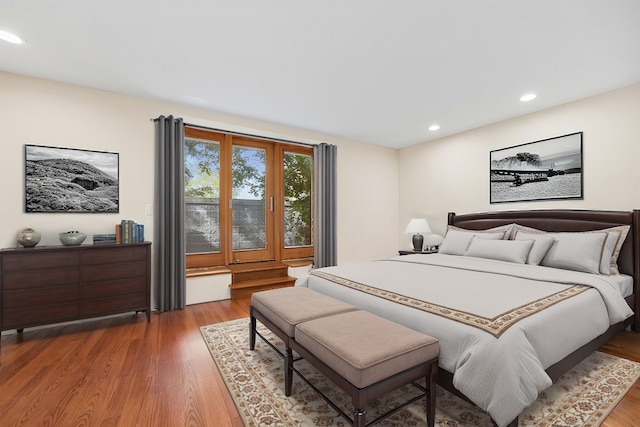 bedroom with hardwood / wood-style floors