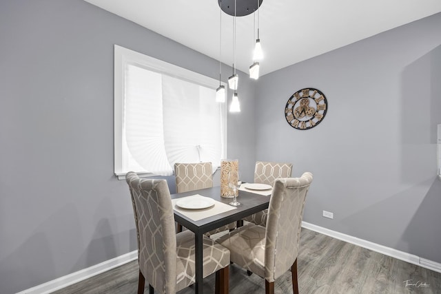 dining space featuring dark hardwood / wood-style flooring