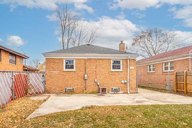 back of house featuring a yard and a patio area