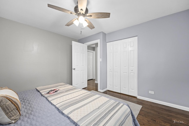 bedroom with a closet, ceiling fan, and dark hardwood / wood-style floors