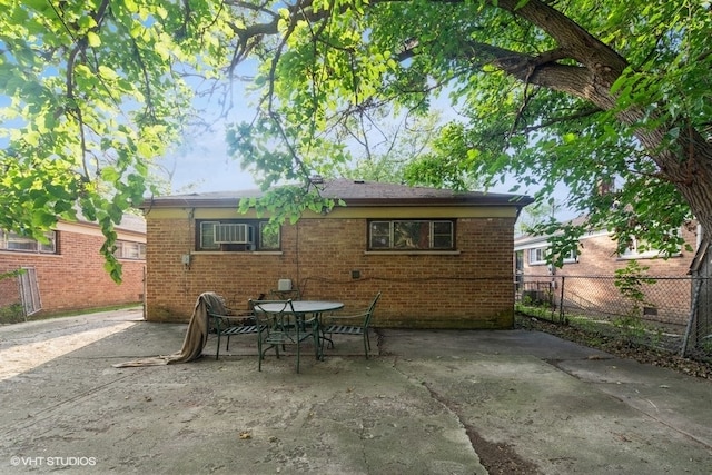 rear view of property featuring a patio area