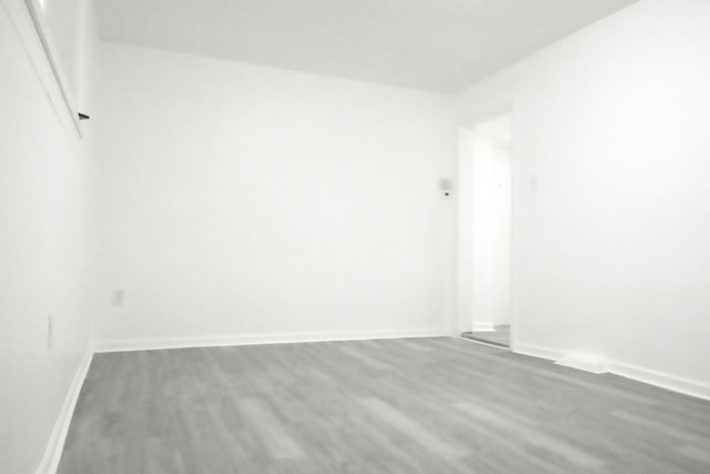 unfurnished room featuring wood-type flooring