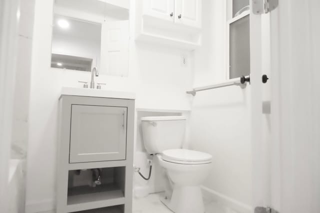 bathroom with vanity and toilet