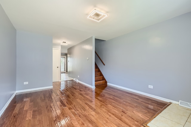 unfurnished room featuring hardwood / wood-style flooring