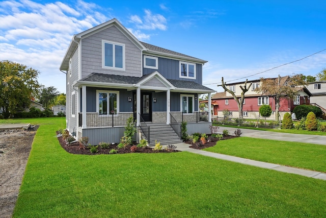 view of front of house featuring a porch and a front yard