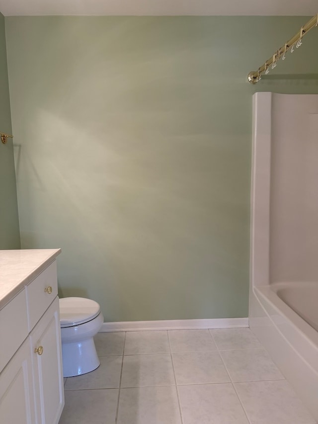 full bath with tile patterned floors, baseboards, toilet, and vanity