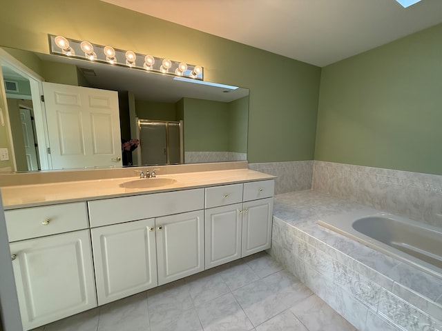 bathroom featuring vanity, a skylight, and plus walk in shower