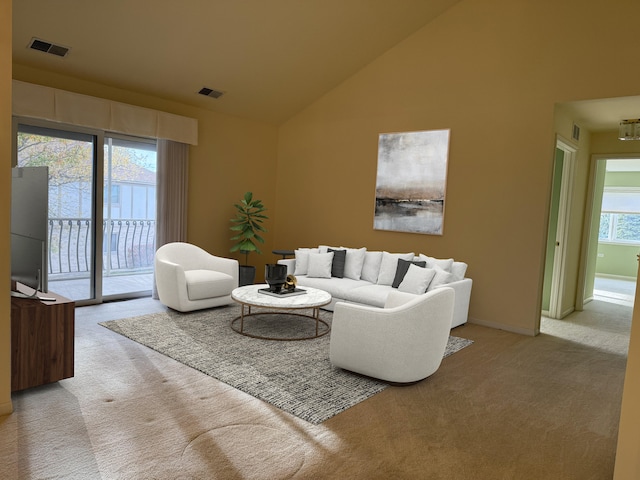 living room with light carpet, visible vents, high vaulted ceiling, and baseboards