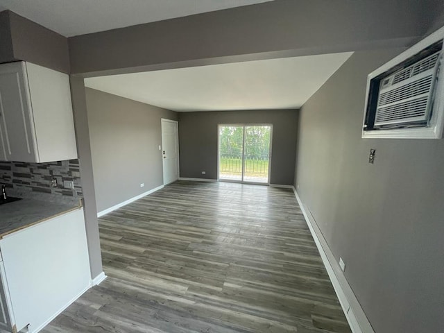 unfurnished living room with hardwood / wood-style floors