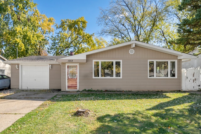 view of front facade with a front yard and a garage