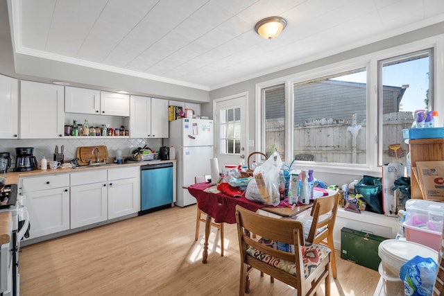 kitchen featuring white cabinetry, stainless steel dishwasher, light hardwood / wood-style flooring, range, and white refrigerator