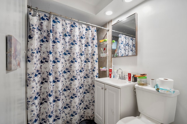 bathroom with vanity, a shower with curtain, and toilet