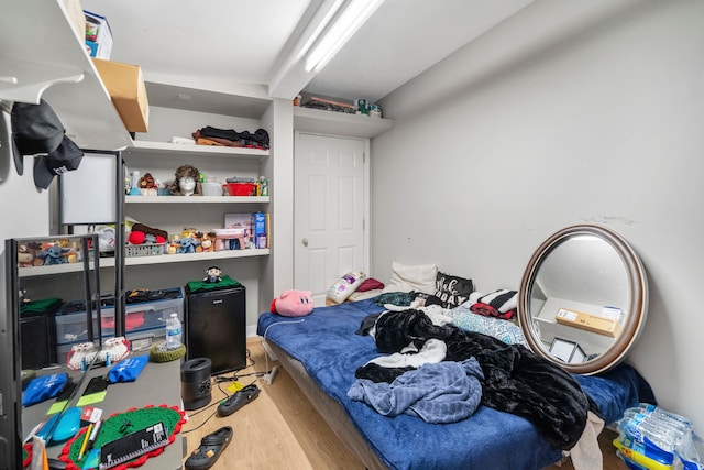 bedroom with wood-type flooring