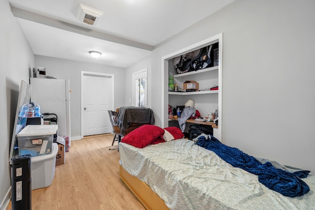 bedroom with light hardwood / wood-style flooring