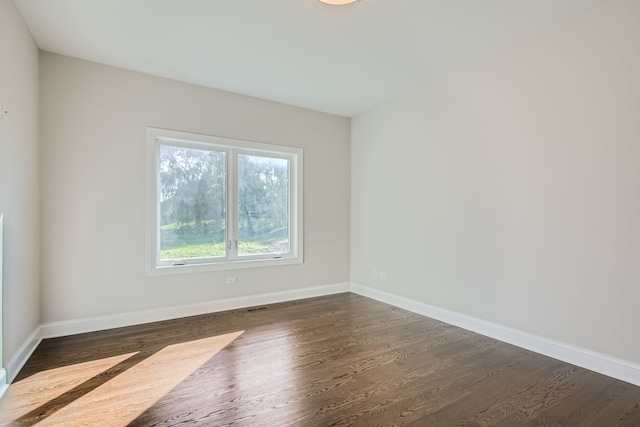 empty room featuring dark hardwood / wood-style floors