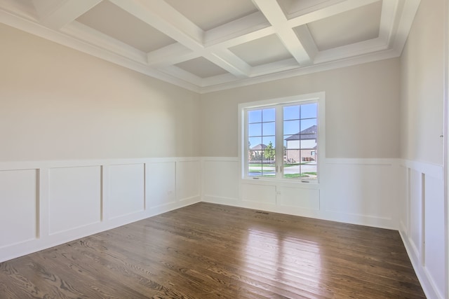 empty room featuring beamed ceiling, coffered ceiling, and dark wood-type flooring