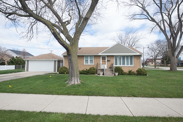 view of front of property with a front yard and a garage