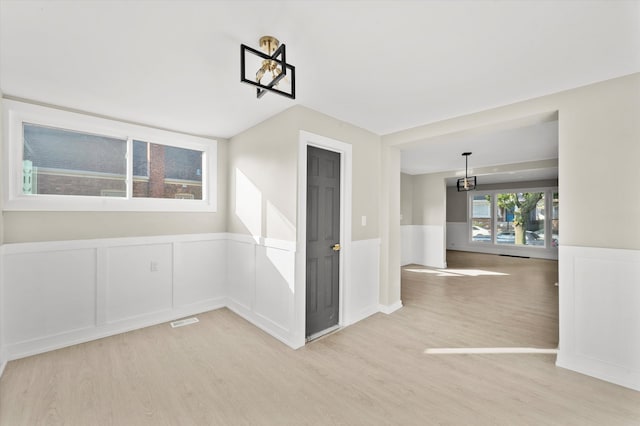 spare room featuring light wood-type flooring