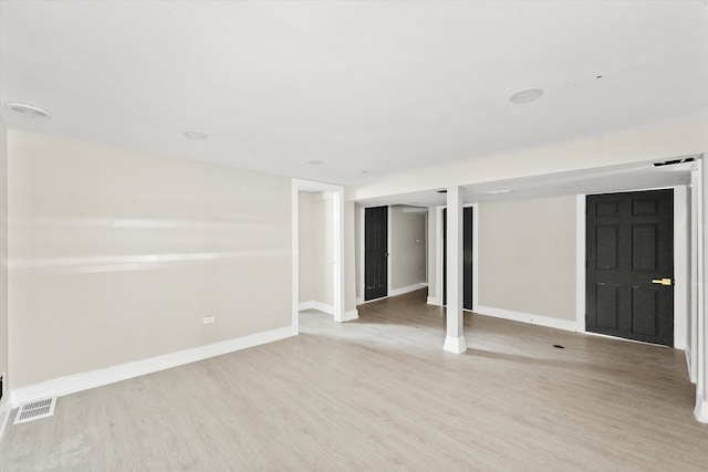 unfurnished room with hardwood / wood-style floors