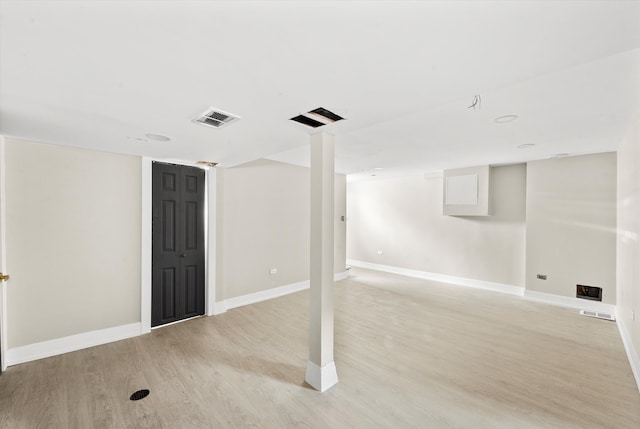 basement featuring light wood-type flooring