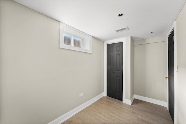 unfurnished bedroom with wood-type flooring