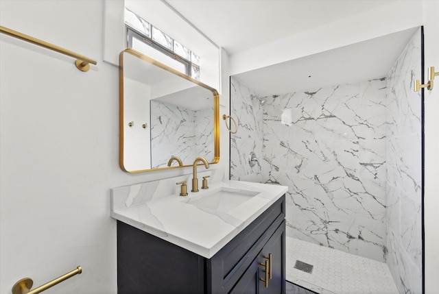 bathroom featuring vanity and a tile shower