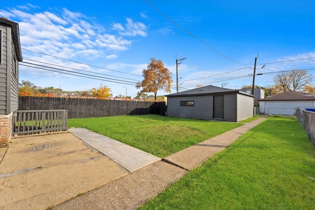 view of yard featuring a patio area and a storage unit