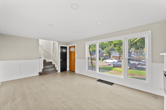 unfurnished living room with light wood-type flooring