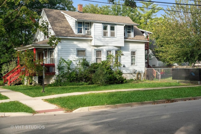 3545 Oak Ave, Brookfield, IL 60513 - view of front of home featuring a porch, a shingled roof, a front lawn, and fence