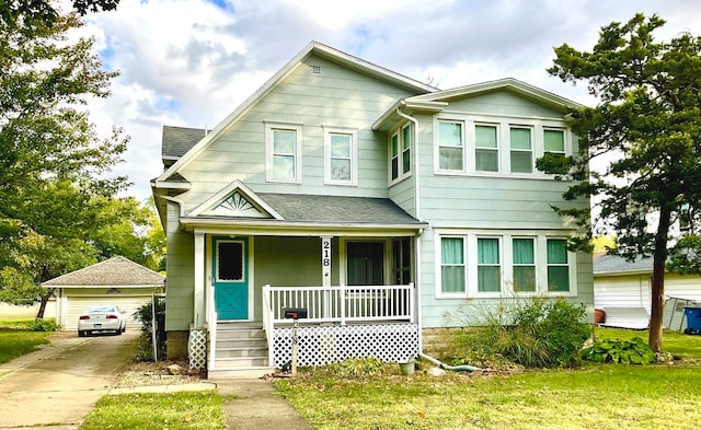 view of front of property featuring a front lawn and covered porch