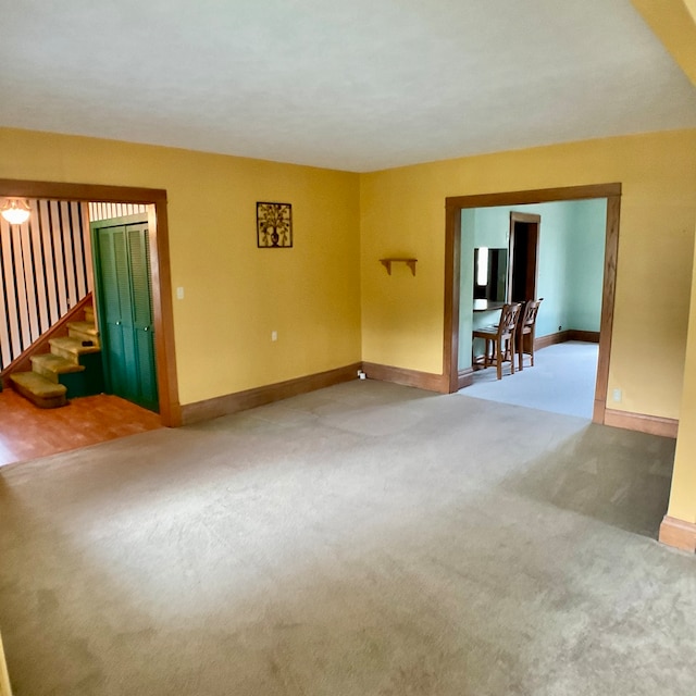 unfurnished living room with carpet floors