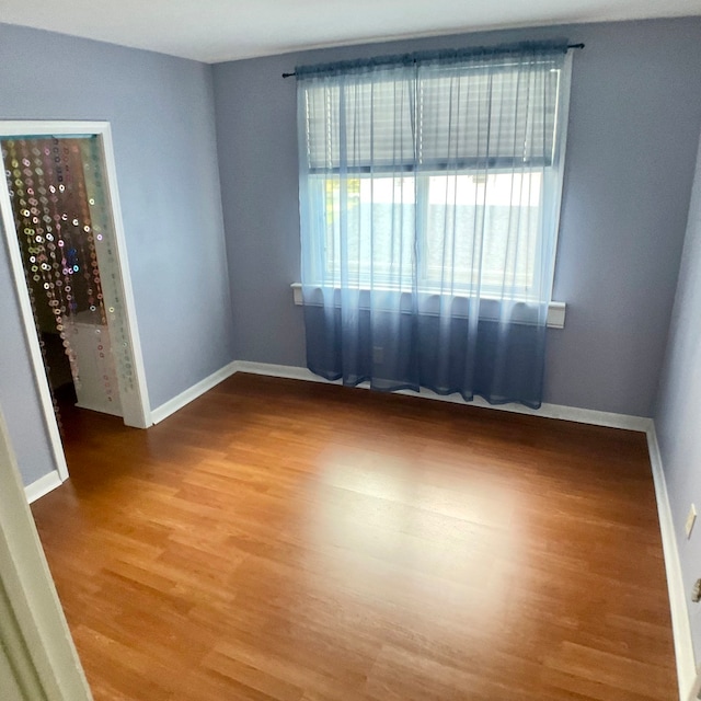 spare room featuring hardwood / wood-style flooring