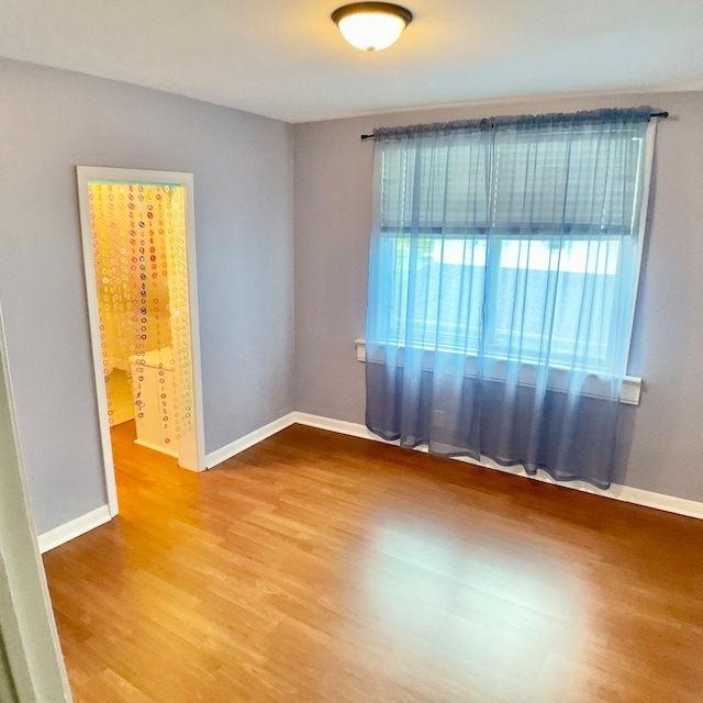 spare room featuring hardwood / wood-style flooring