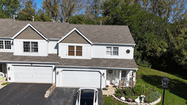 view of front facade featuring a front lawn and a garage