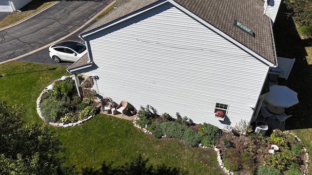 view of side of home featuring a lawn