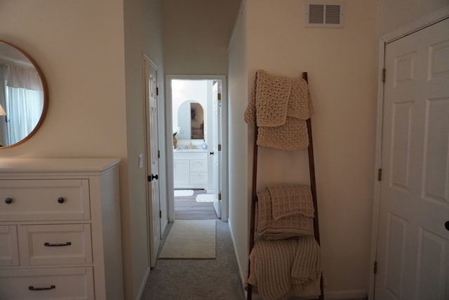 hallway with light carpet