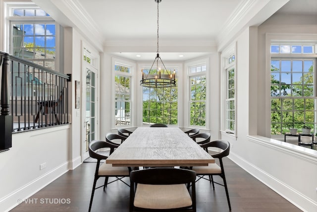 sunroom featuring a healthy amount of sunlight and a chandelier