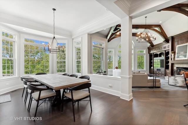 dining space featuring ornamental molding, dark hardwood / wood-style floors, vaulted ceiling, and a healthy amount of sunlight