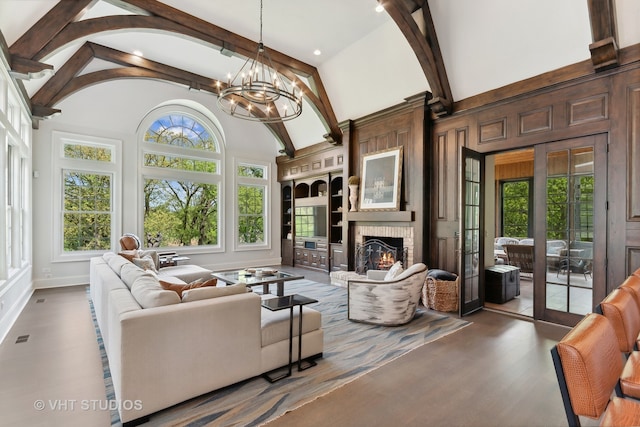 living room featuring high vaulted ceiling, a fireplace, plenty of natural light, and dark hardwood / wood-style flooring